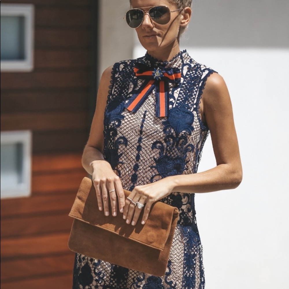 Lace cocktail dress with brooch size small.